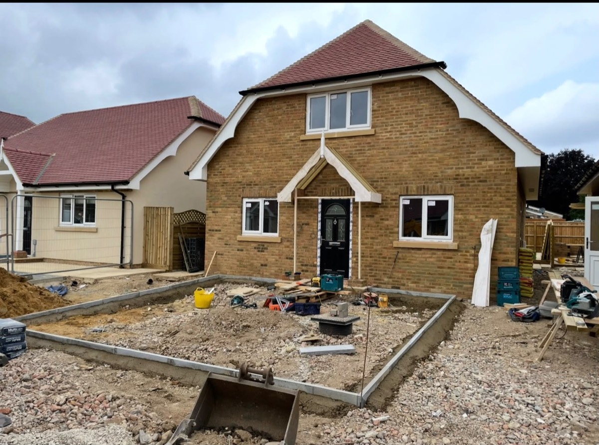 House nearing completion with driveway groundworks underway
