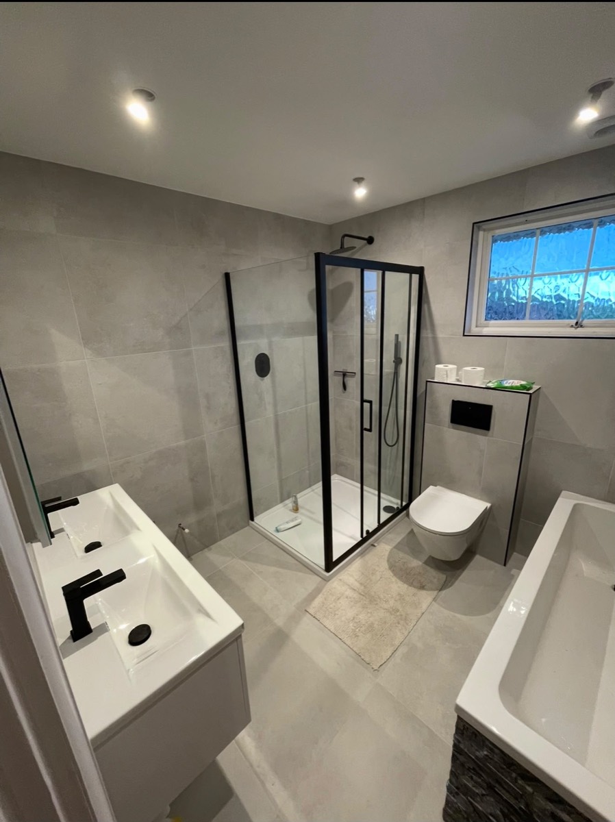 Finished contemporary bathroom with walk in shower and dual vanity